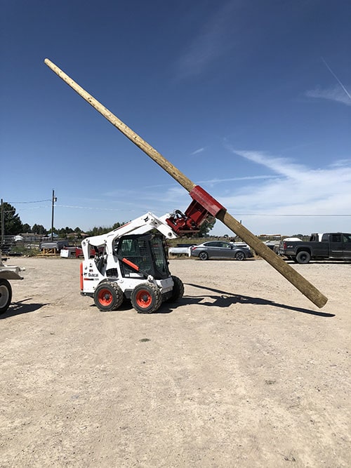 STS Electric crew setting a commercial power pole